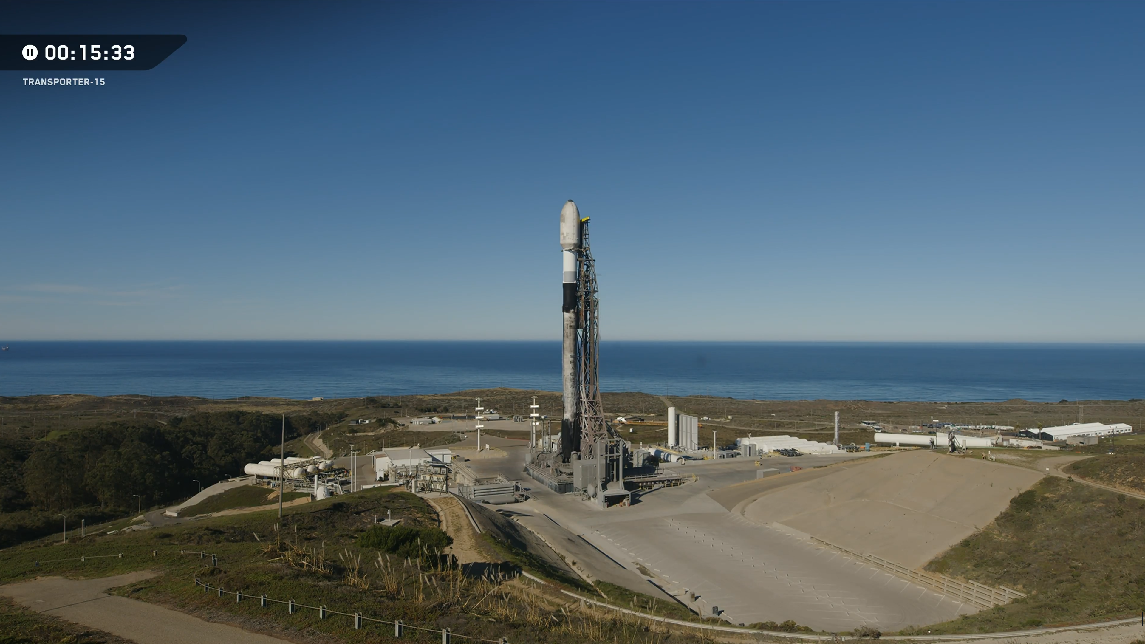 A used SpaceX rocket on a seaside launch pad in California ahead of the Transporter-15 launch.