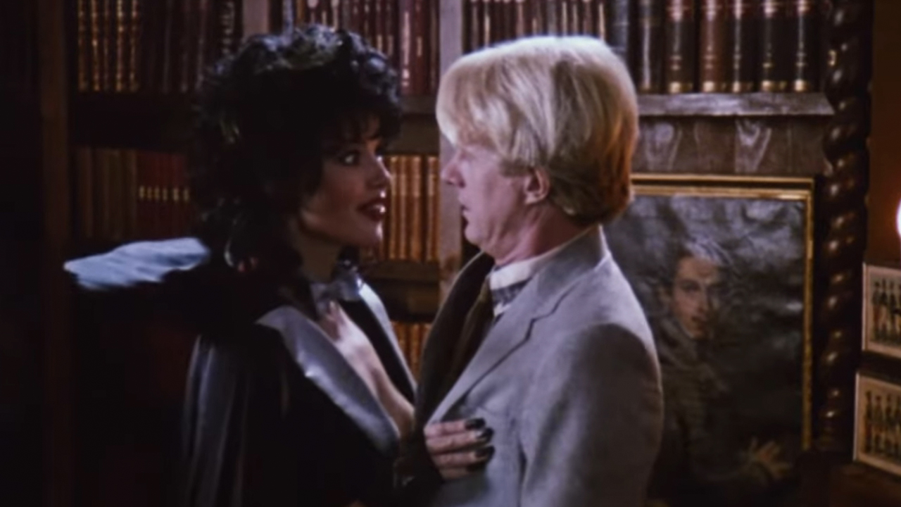 Geena Davis as a vampire grabbig Ed Begley, Jr.