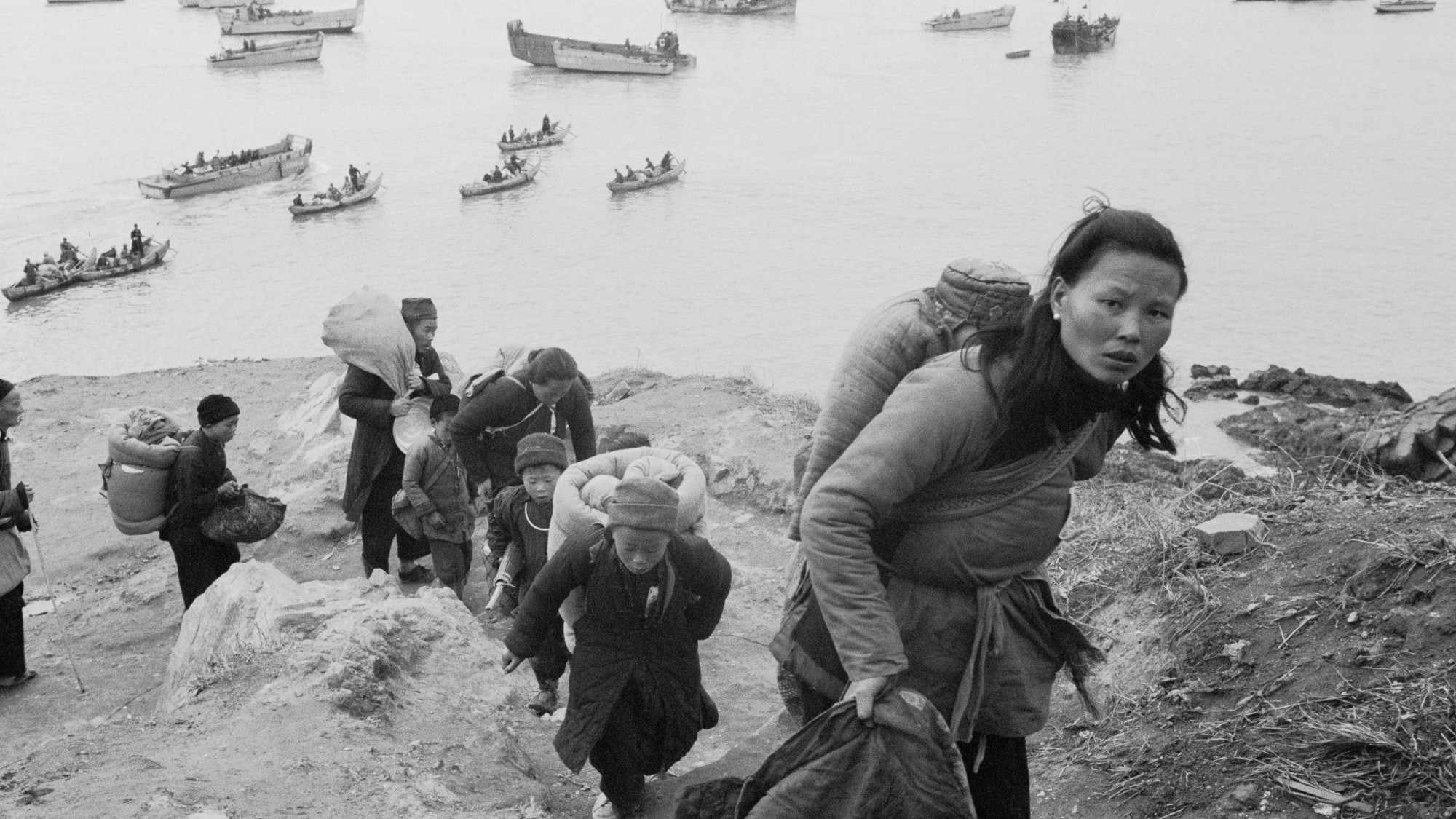 Chinese refugees travelling from arriving onshore from boats