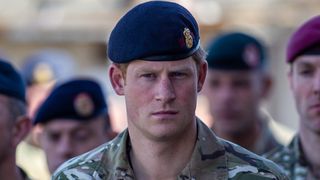 Prince Harry in military combat dress uniform joins British troops and service personal