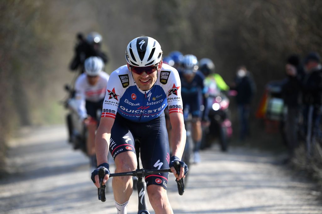 SIENA ITALY MARCH 05 Kasper Asgreen of Denmark and Team QuickStep Alpha Vinyl competes in the chase during the Eroica 16th Strade Bianche 2022 Mens Elite a 184km one day race from Siena to Siena Piazza del Campo 321m StradeBianche WorldTour on March 05 2022 in Siena Italy Photo by Tim de WaeleGetty Images
