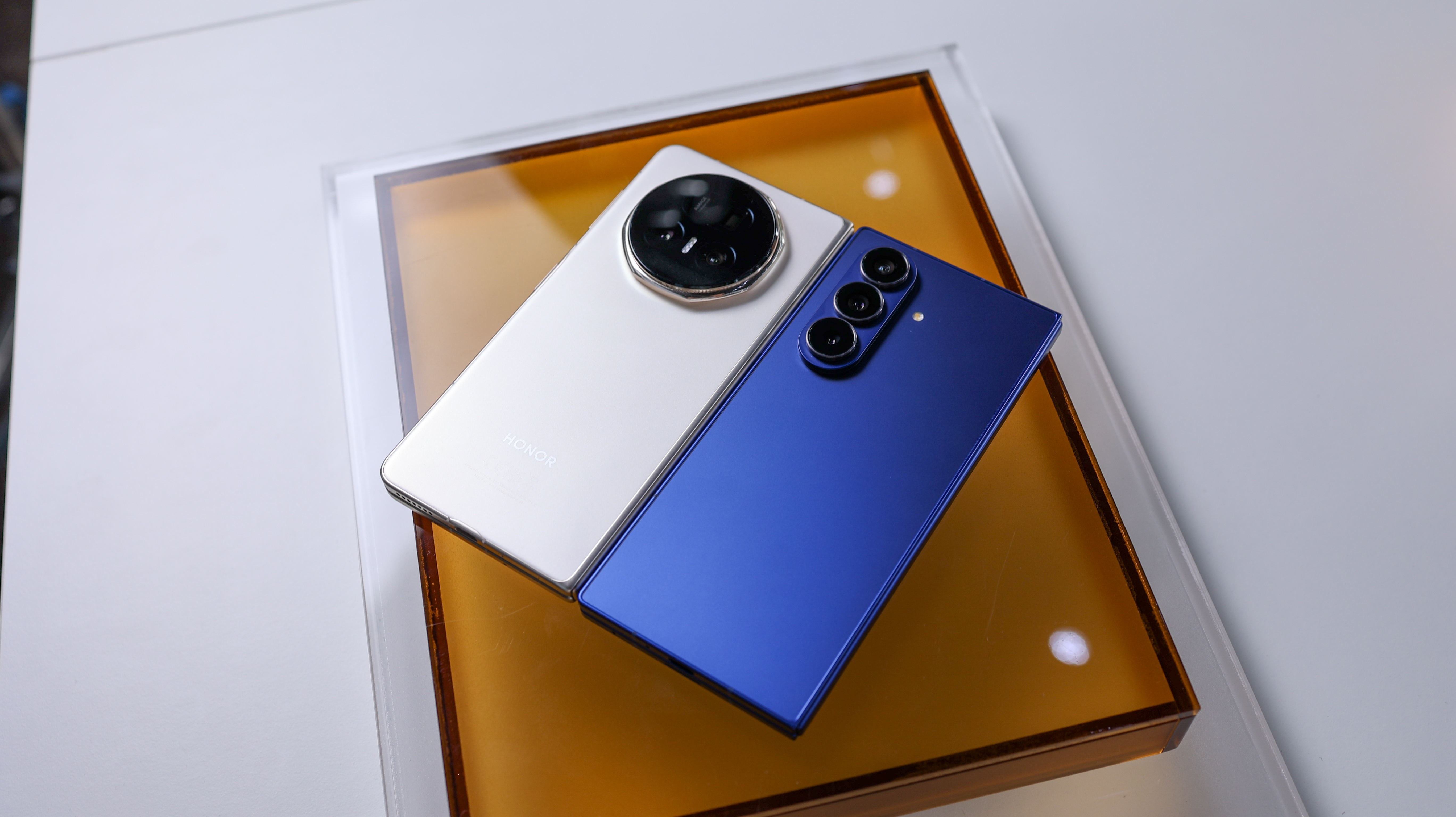 A photo of the Samsung Galaxy Z Fold 7 and the Honor Magic V5