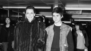 Actress Audrey Hepburn and her son Luca Dotti at an airport. April 1984