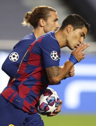 Luis Suarez (right) remains a potent force for Barcelona