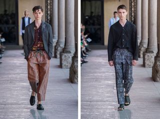 Models wear tailored trousers, black shirt and dark grey jacket at Pal Zileri S/S 2018