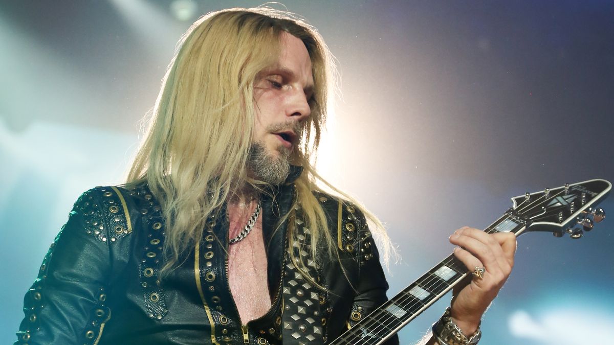 Richie Faulkner onstage with Judas Priest in 2023