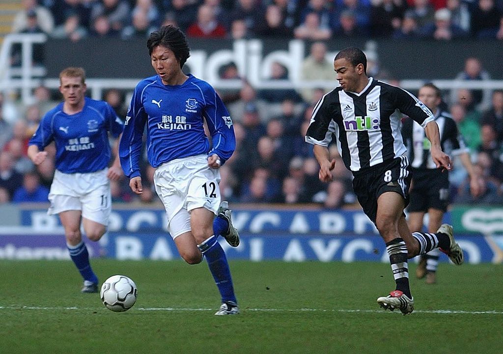 Li Tie of Everton goes past Kieron Dyer of Newcastle during the FA Barclaycard Premiership match between Newcastle United and Everton at St James&#039;s Park, Newcastle on December 1, 2002