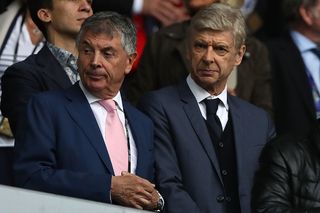 Arsenal Manager Arsene Wenger (R) looks on with former Arsenal Vice-Chairman David Dein during the UEFA EURO 2016 Group A match between Switzerland and France at Stade Pierre-Mauroy on June 19, 2016 in Lille, France.