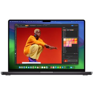 Apple MacBook Pro 14-inch (M3) laptop with screen open showing Photoshop app