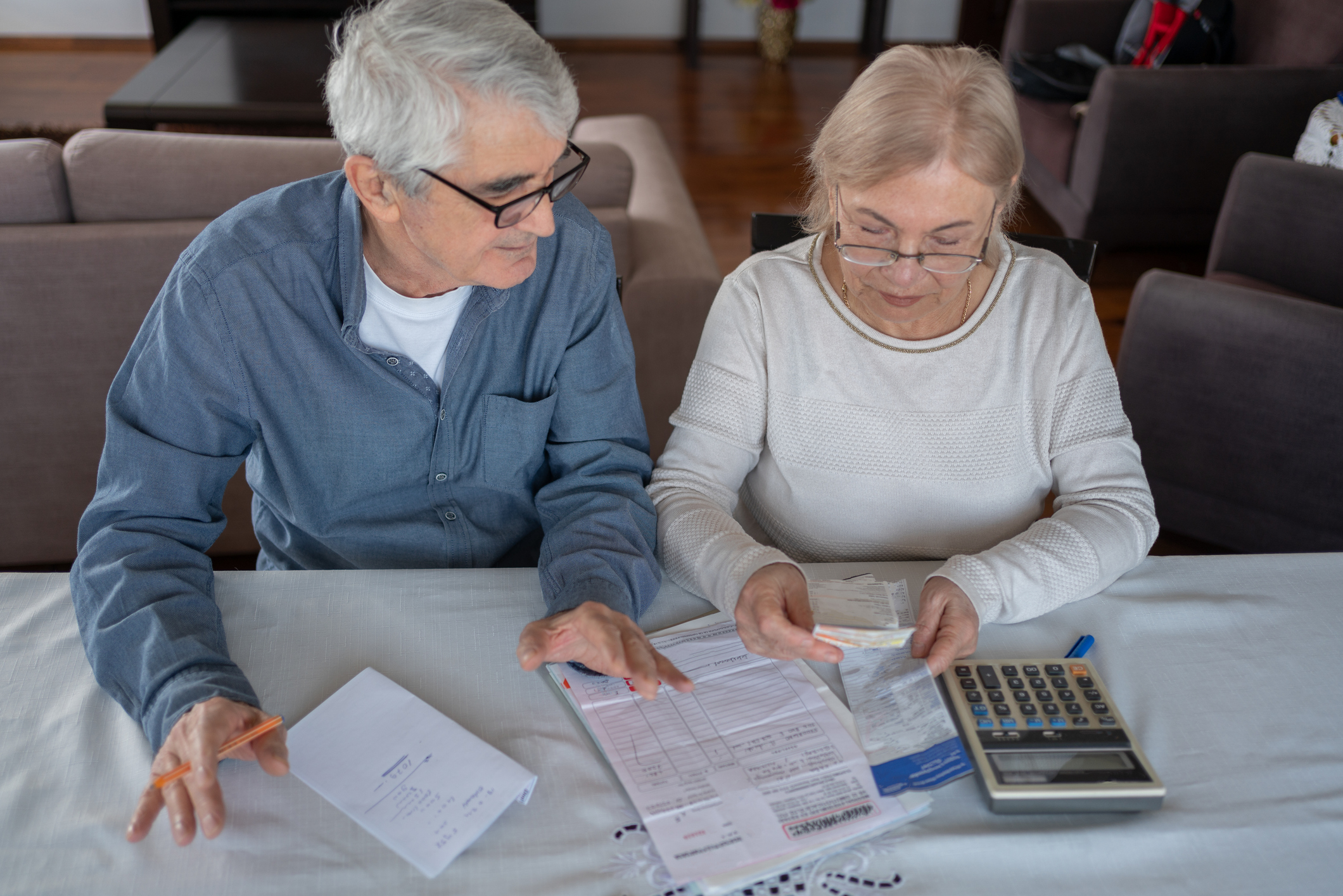 Couple look at finances as they look at how to reduce inheritance tax liabilities.