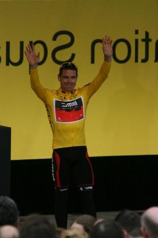 Cadel Evans waves to the tens of thousands of fans in Federation Square