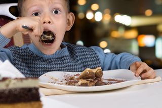 gobbling food, chocolate cake, boy eating