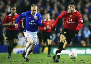 Everton's Tony Hibbert chases after Manchester United's Cristiano Ronaldo in a Premier League game in 2005.