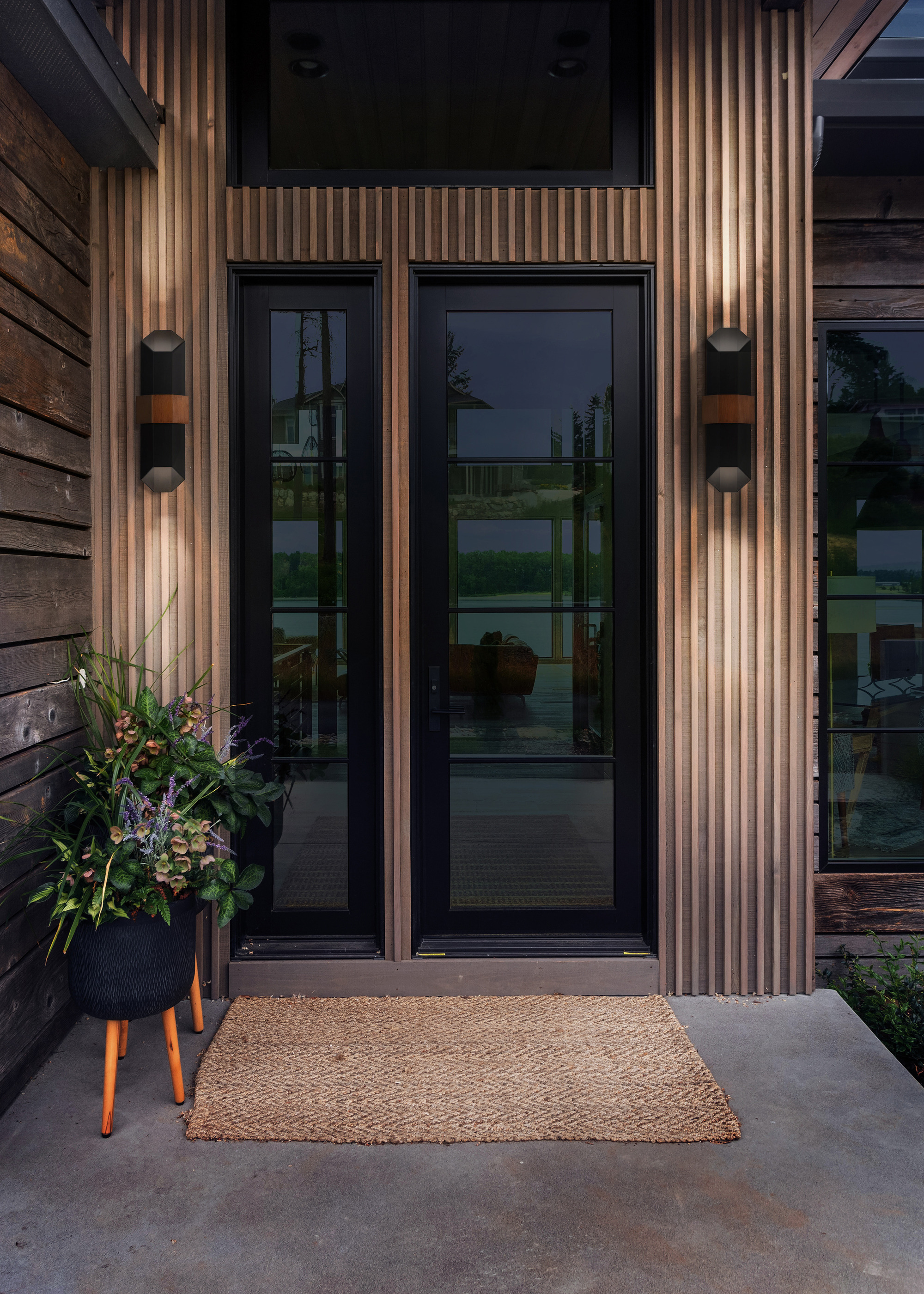 Quoizel Chasm LED Wall Lanterns either side of a glass front door