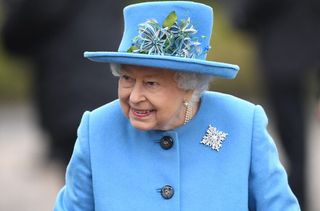 queen supports prince harry meghan markle canadian brooch