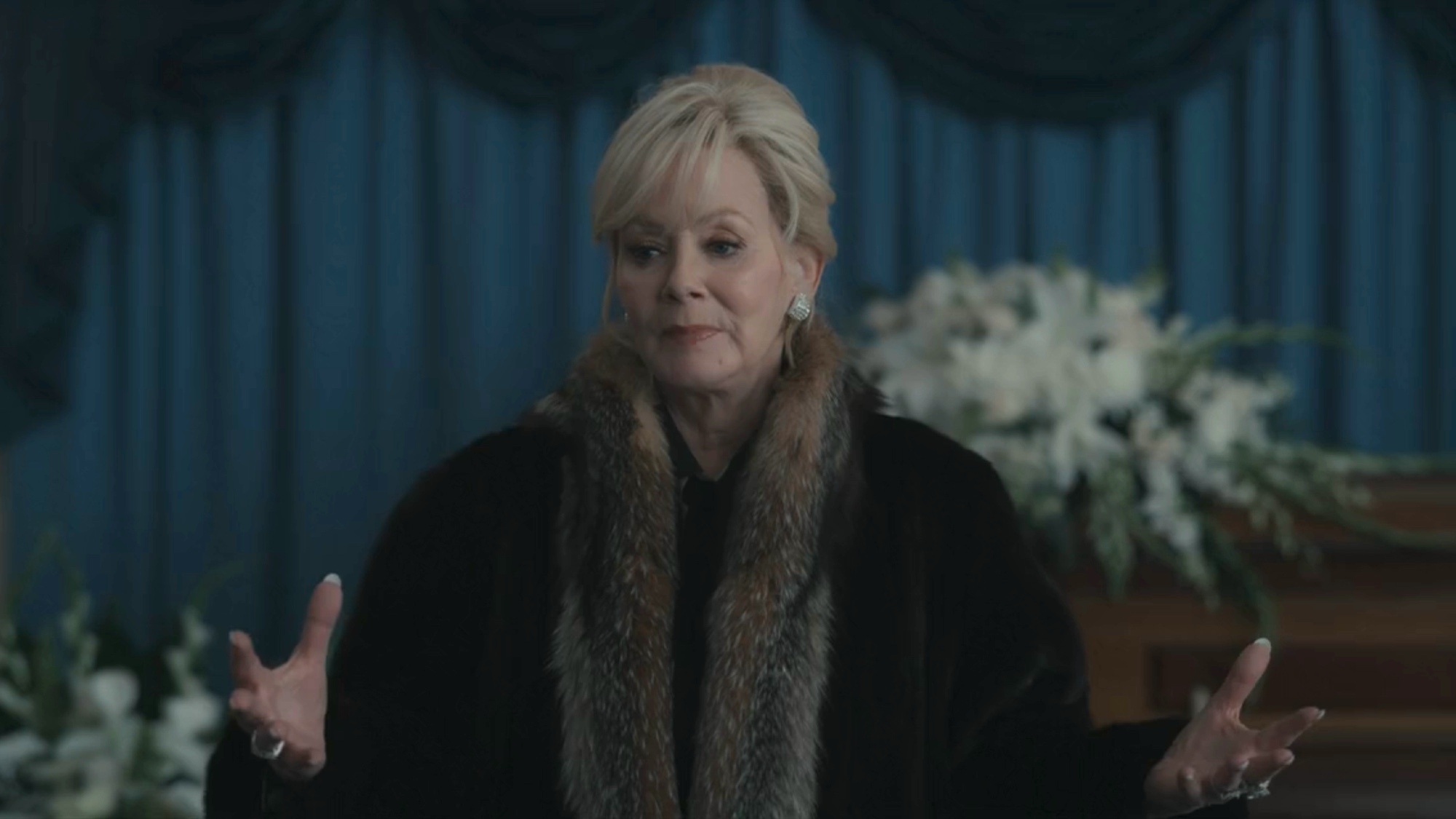 Jean Smart as Deborah Vance gives a speech at Ava's Father's funeral in Season 1, Episode 10 of Hacks.