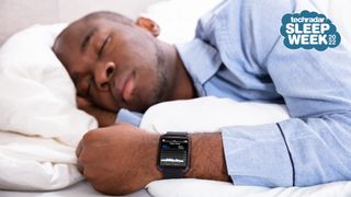 Sleep Awareness Week 2022: Man sleeping in bed wearing smartwatch