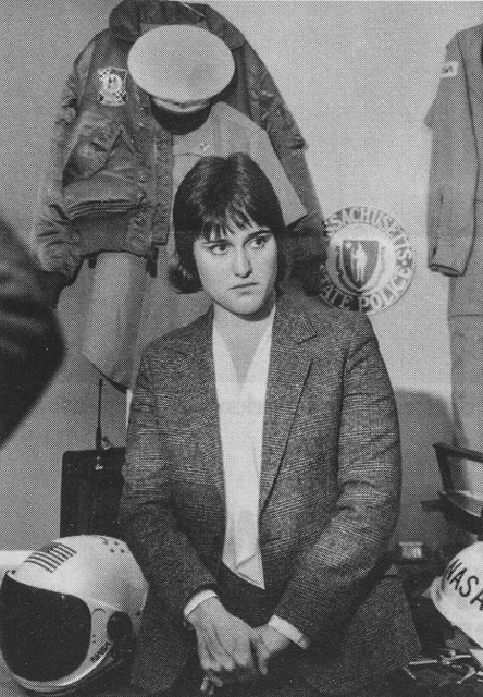a woman surrounded by stolen NASA helmets