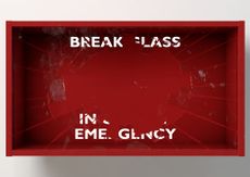A red box with the words "break glass in case of emergency" partially obscured, as the glass has been broken.
