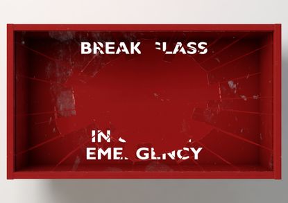 A red box with the words "break glass in case of emergency" partially obscured, as the glass has been broken.