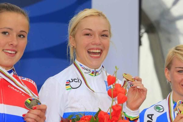 Lucy Garner smiles with her gold medal