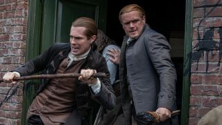 Outlander Jamie and Lord John ward off tar and feathers