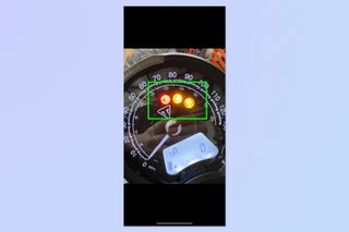 A screenshot showing how to use Visual Look Up to identify dashboard lights on iPhone