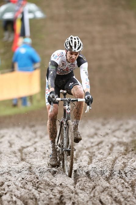 Wietse Bosmans (BKCP Powerplus) rides through the mud to a 7th place finish.