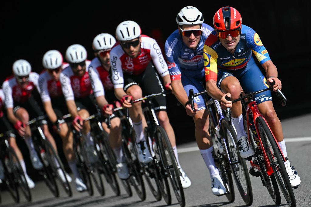Lidl-Trek's Italian rider Jacopo Mosca (R) rides ahead of the pack during the 115th Milan-SanRemo one-day classic cycling race, between Pavia and SanRemo, on March 16, 2024. (Photo by Marco BERTORELLO / AFP)