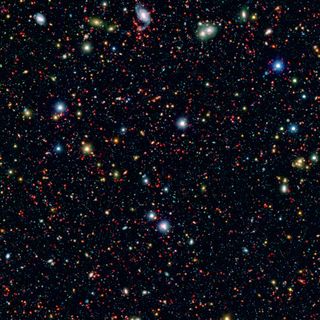 The Spitzer Space Telescope is trolling for huge, early galaxies in areas of the sky such as this COSMOS field, which is short for Cosmic Evolution Survey.
