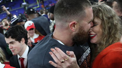 Travis Kelce #87 of the Kansas City Chiefs embraces Taylor Swift after a 17-10 victory against the Baltimore Ravens in the AFC Championship Game