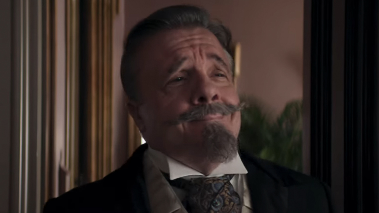 A close up of Nathan Lane smiling in The Gilded Age