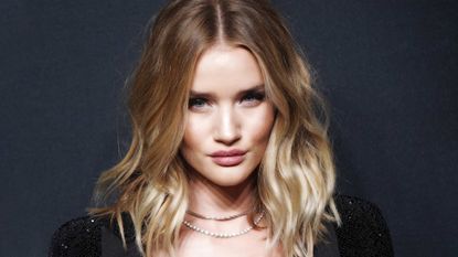 Rosie Huntington-Whiteley pictured with thick glossy wavy hair
