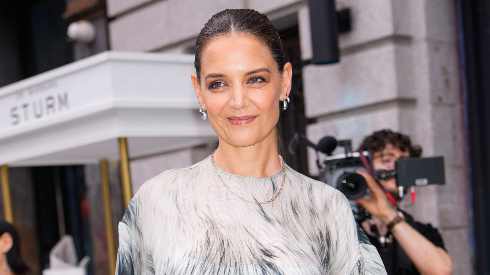Katie Holmes wears a sheer top and black cargo pants