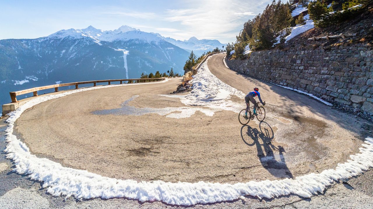 image of a cyclist riding in the snow