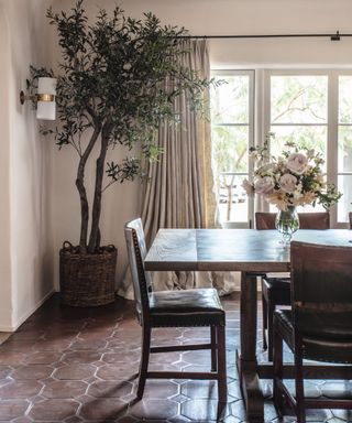 neutral dining room with wooden table and leather dining chairs