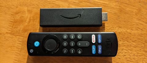 A Fire TV Stick 4K and the Alexa Voice Remote side by side on a table