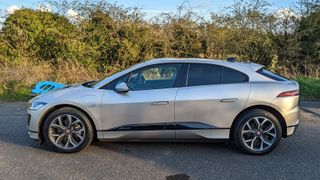 jaguar i-pace side view on country lane