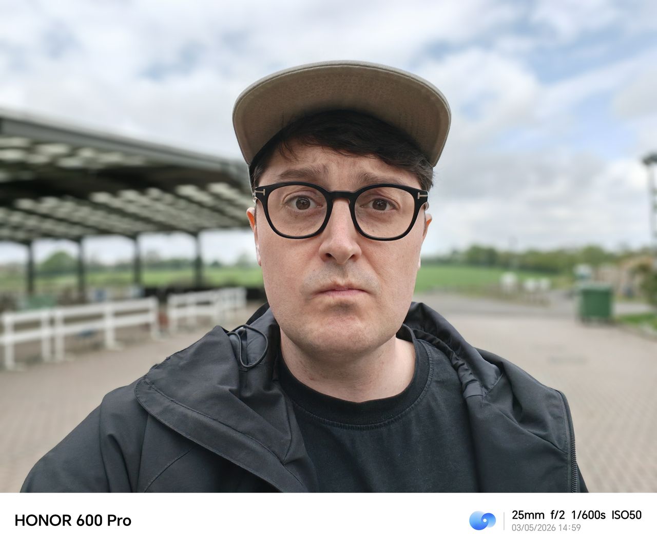 Portrait selfie with a blurred outdoor sports ground background