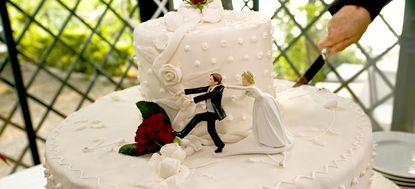 Wedding cake topper featuring bride and groom