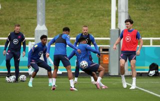 Harry Maguire (right) was among the England players who trained on Monday