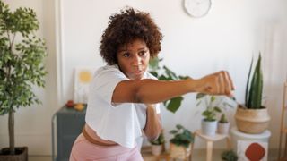 Woman punching at home