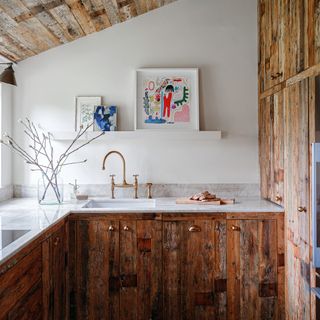 Wooden panelled kitchen area