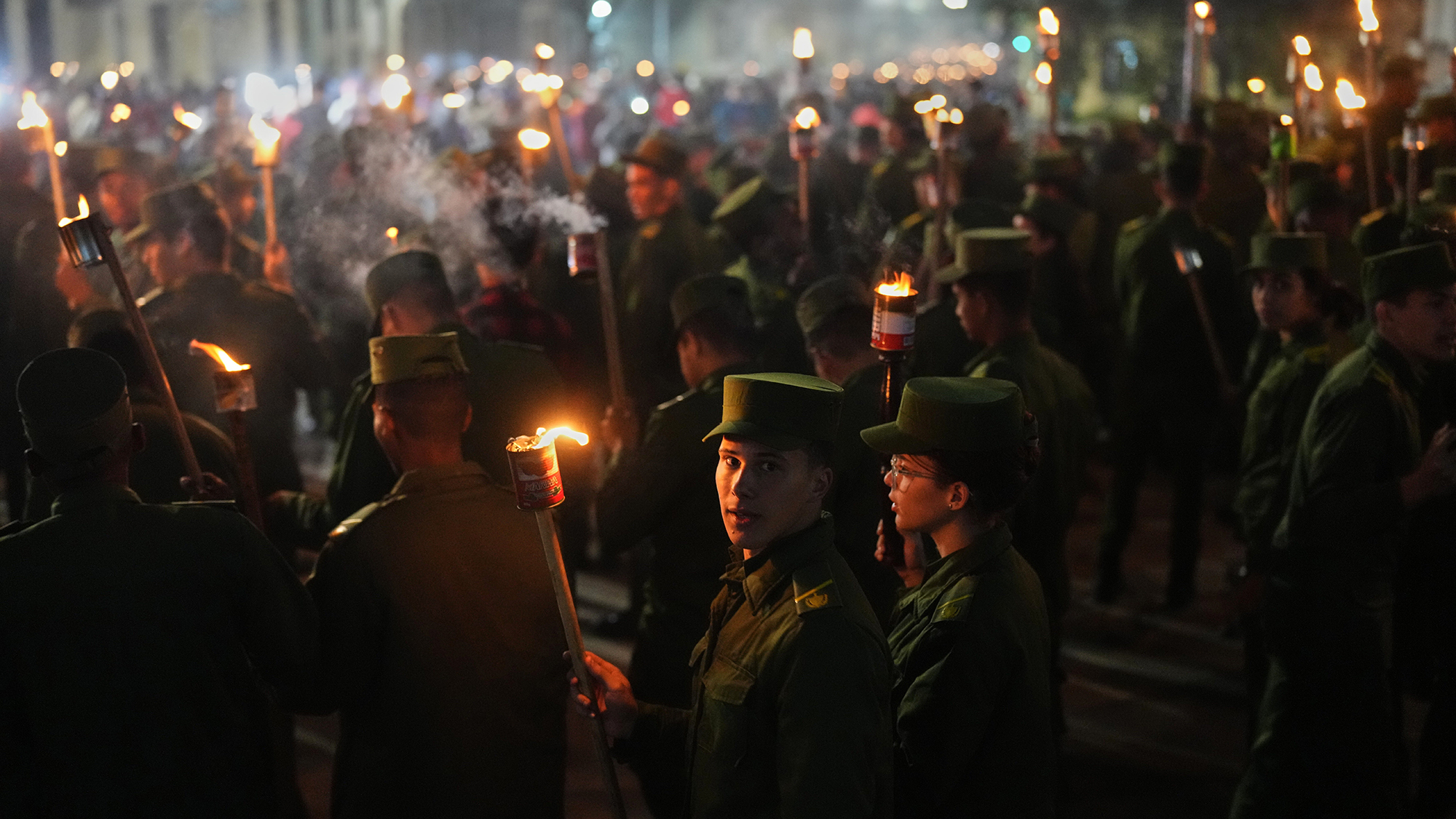 Soldiers march with torches to mark the 173rd anniversary of the birth of national independence hero Jos&amp;eacute; Mart&amp;iacute; in Havana, Cuba