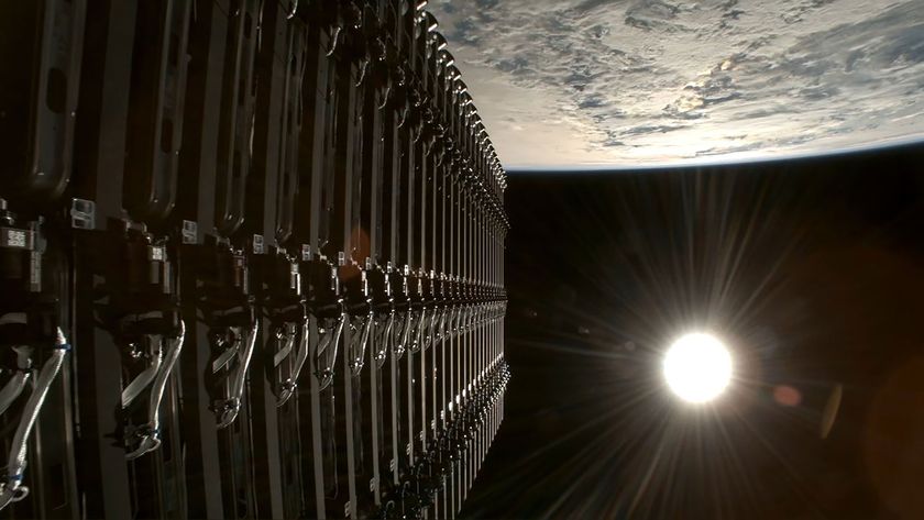 a stack of satellites are deployed into Earth orbit with the full sun visible