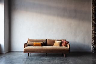 velvet bench seat sofa in an open industrial space