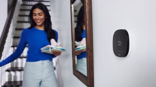 The Ecobee SmartThermostat attahed on a wall in a home