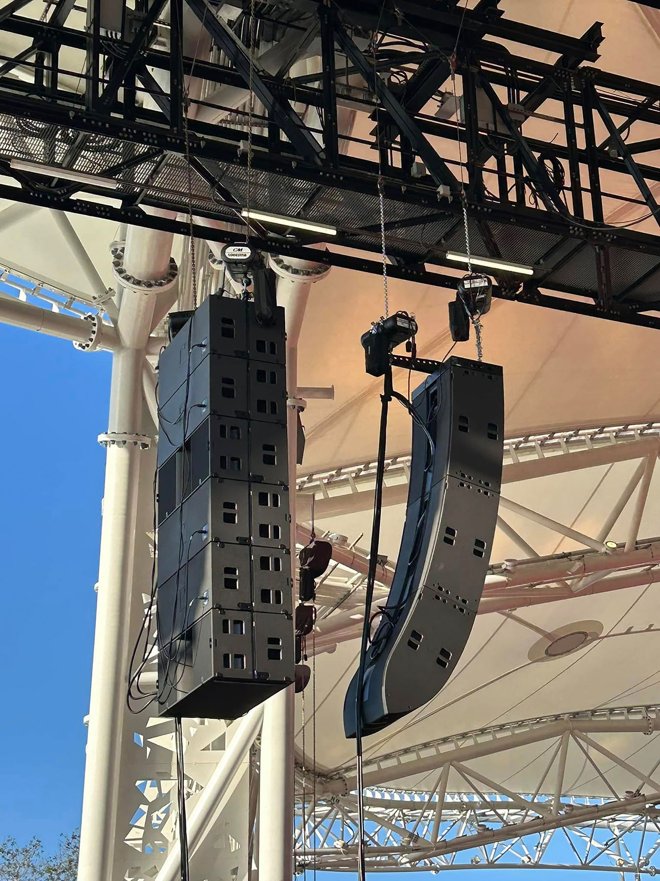 A close-up view of the house-right L-Acoustics L2/L2D main array and KS28 subwoofer hangs.