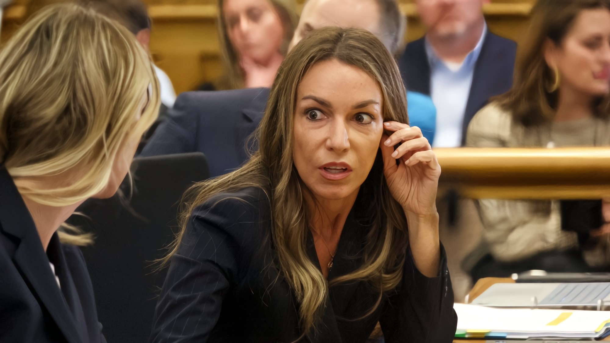 Karen Read chats with her defense team at Karen Read's second murder trial on April 22. (Staff Photo By Stuart Cahill/Boston Herald)