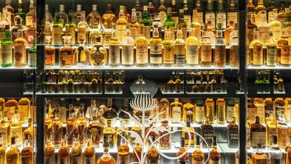 The Glenmorangie distillery branding on the orange wall of the visitor  centre in Tain Stock Photo - Alamy